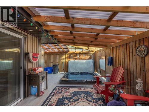 Sunken hot tub on covered deck - 1206 43 Avenue, Vernon, BC - Indoor Photo Showing Other Room