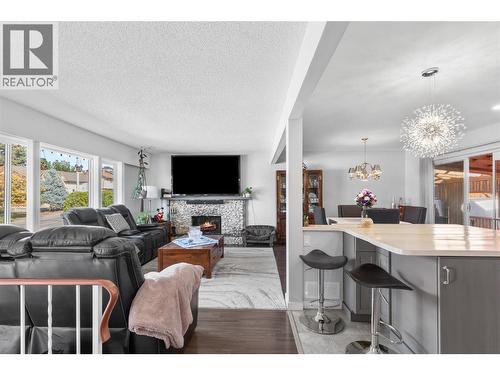 Open concept Main floor - 1206 43 Avenue, Vernon, BC - Indoor Photo Showing Living Room With Fireplace