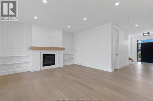 7355 Garnet, Mcgregor, ON - Indoor Photo Showing Living Room With Fireplace