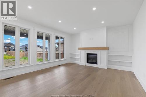 7355 Garnet, Mcgregor, ON - Indoor Photo Showing Living Room With Fireplace