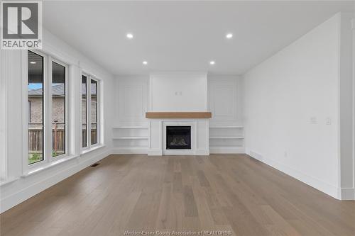 7355 Garnet, Mcgregor, ON - Indoor Photo Showing Living Room With Fireplace