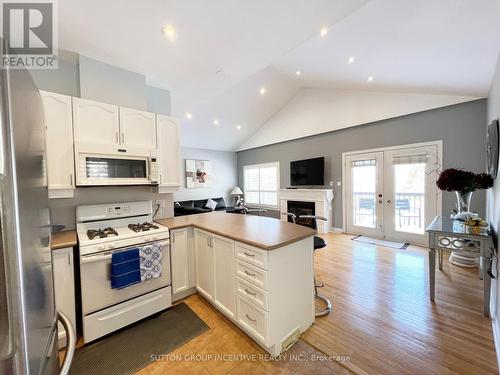 38 Hurst Drive, Barrie, ON - Indoor Photo Showing Kitchen With Fireplace