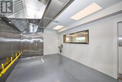 Kitchen and prep area facing the service window - 