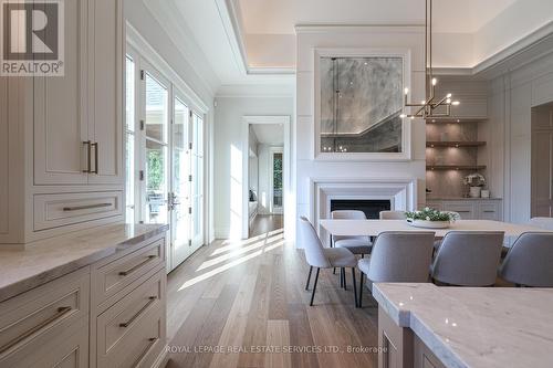 16 Eversley Hall, King, ON - Indoor Photo Showing Dining Room With Fireplace