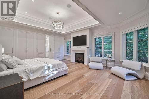 16 Eversley Hall, King, ON - Indoor Photo Showing Bedroom With Fireplace