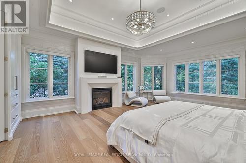 16 Eversley Hall, King, ON - Indoor Photo Showing Bedroom With Fireplace