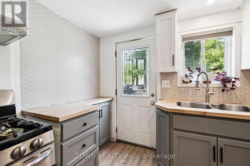 64 Sheaffe Street, Hamilton, ON - Indoor Photo Showing Kitchen With Double Sink