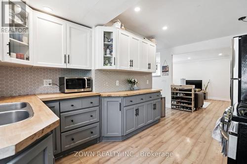 64 Sheaffe Street, Hamilton, ON - Indoor Photo Showing Kitchen With Double Sink