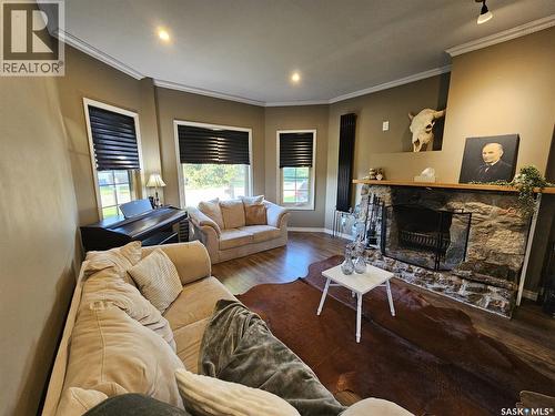 608 Walsh Avenue, Oxbow, SK - Indoor Photo Showing Living Room With Fireplace