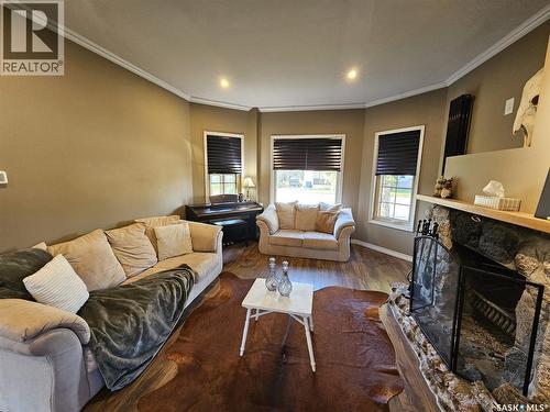 608 Walsh Avenue, Oxbow, SK - Indoor Photo Showing Living Room With Fireplace