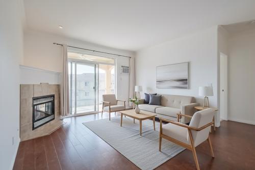 411-1962 Enterprise Way, Kelowna, BC - Indoor Photo Showing Living Room With Fireplace