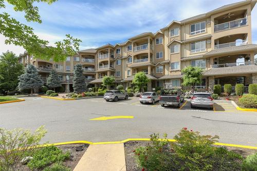411-1962 Enterprise Way, Kelowna, BC - Outdoor With Balcony With Facade