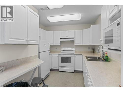 Clubhouse - 1963 Durnin Road Unit# 303, Kelowna, BC - Indoor Photo Showing Kitchen With Double Sink