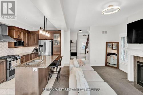 15 Severino Circle, West Lincoln, ON - Indoor Photo Showing Kitchen With Fireplace With Upgraded Kitchen