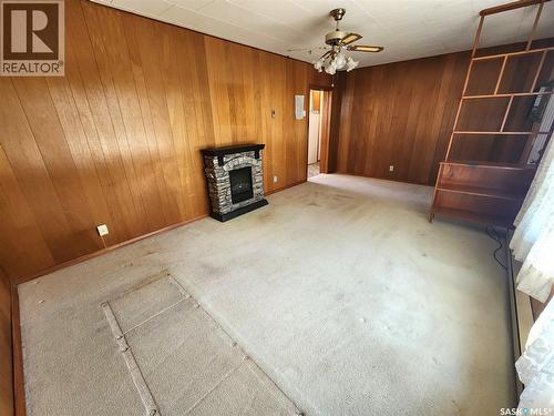 208 2Nd Avenue E, Lampman, SK - Indoor Photo Showing Other Room With Fireplace