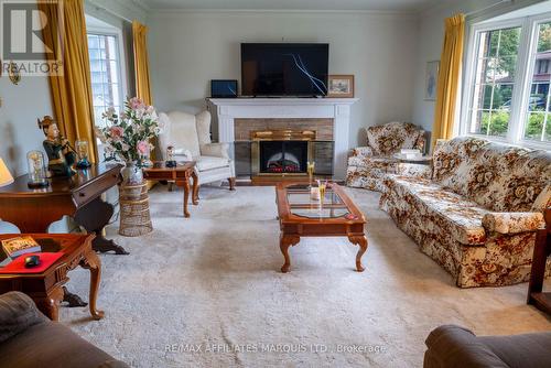 Living room - Electric fireplace -two bay windows - 601 Fourth Street E, Cornwall, ON - Indoor Photo Showing Living Room With Fireplace