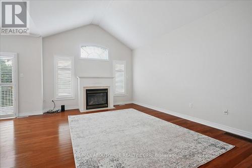 Spacious family room with gas fireplace - 2348 Tesla Crescent, Oakville, ON - Indoor Photo Showing Living Room With Fireplace