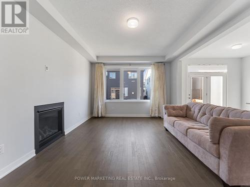 1017 Curraglass Walk, Ottawa, ON - Indoor Photo Showing Living Room With Fireplace