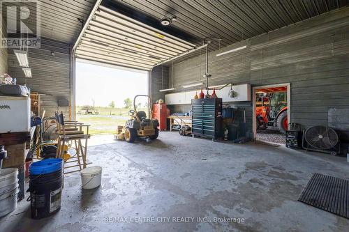 Heated shop side of workship with overhead door - 19152 County Road 25, South Glengarry, ON - Indoor Photo Showing Garage