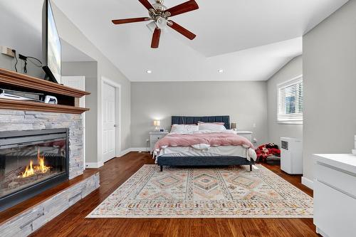 420 Hardie Road, Kelowna, BC - Indoor Photo Showing Bedroom With Fireplace