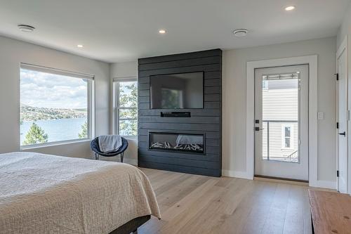 13980 Ponderosa Way, Coldstream, BC - Indoor Photo Showing Bedroom With Fireplace