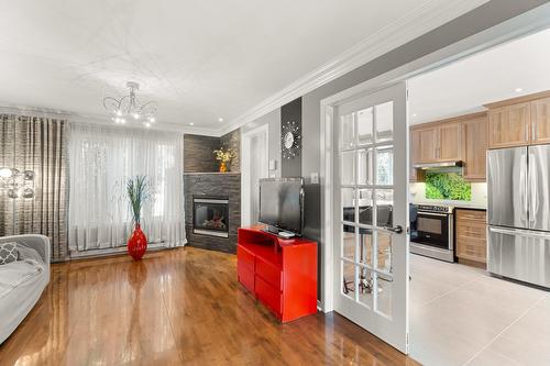 Living room - 7125 Rue Marie-Boucher, Trois-Rivières, QC - Indoor Photo Showing Kitchen With Fireplace