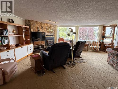 8 275 Alpine Crescent, Swift Current, SK - Indoor Photo Showing Living Room With Fireplace