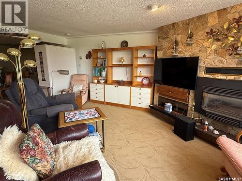 8 275 Alpine Crescent, Swift Current, SK - Indoor Photo Showing Living Room With Fireplace
