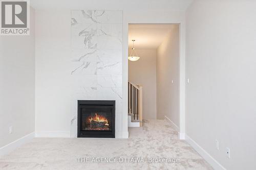 183 Craig Duncan Terrace, Ottawa, ON - Indoor Photo Showing Other Room With Fireplace