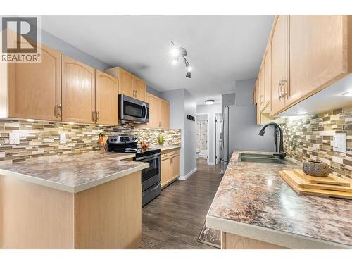 3163 Richter Street Unit# 413, Kelowna, BC - Indoor Photo Showing Kitchen With Double Sink With Upgraded Kitchen