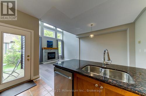 Open-Concept  Social Living. - 15 - 6 Wildrose Trail, Collingwood, ON - Indoor Photo Showing Kitchen With Fireplace With Double Sink