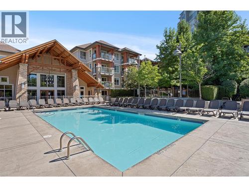 Large pool deck - 1075 Sunset Drive Unit# 1404, Kelowna, BC - Outdoor With In Ground Pool