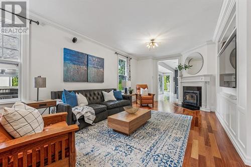 Living Room Features a Woodburning Fireplace - 335 Lakeshore Road W, Oakville, ON - Indoor Photo Showing Living Room With Fireplace