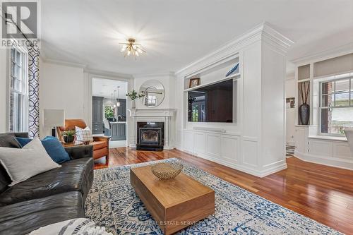 Open Dining & Living Areas Ideal for Entertaining - 335 Lakeshore Road W, Oakville, ON - Indoor Photo Showing Living Room With Fireplace