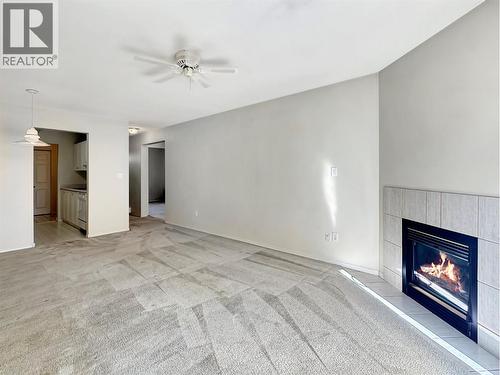 1004 23 Avenue N Unit# 113, Cranbrook, BC - Indoor Photo Showing Living Room With Fireplace