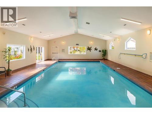 609 Truswell Road Unit# 175, Kelowna, BC - Indoor Photo Showing Other Room With In Ground Pool