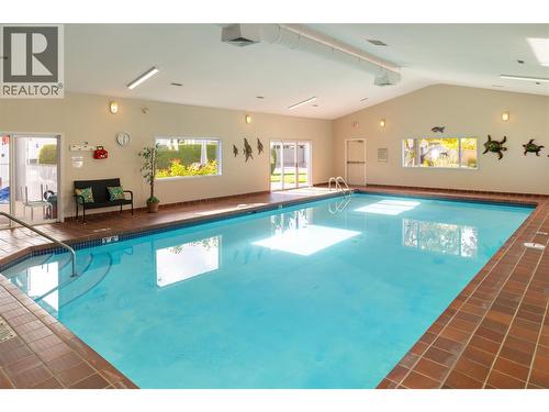 609 Truswell Road Unit# 175, Kelowna, BC - Indoor Photo Showing Other Room With In Ground Pool