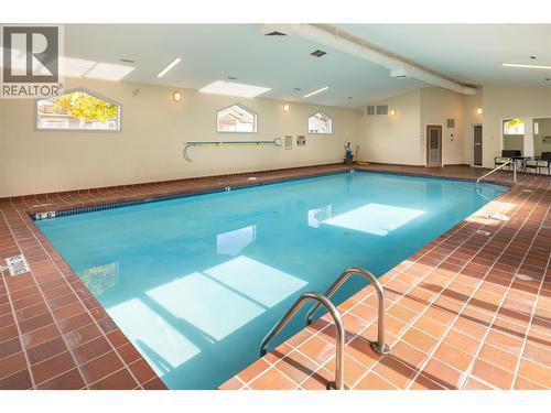 609 Truswell Road Unit# 175, Kelowna, BC - Indoor Photo Showing Other Room With In Ground Pool