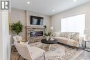 135 Traeger Common, Saskatoon, SK  - Indoor Photo Showing Living Room With Fireplace 