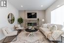 135 Traeger Common, Saskatoon, SK  - Indoor Photo Showing Living Room With Fireplace 