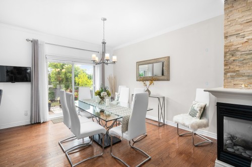 Salle à manger - 10Z Crois. Mirabel, Dollard-Des-Ormeaux, QC - Indoor Photo Showing Dining Room With Fireplace