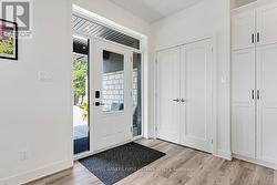 Bright airy foyer has double closet - 