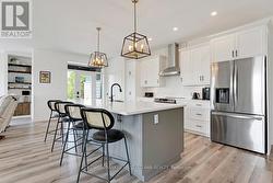 Quartz counters; lovely two-toned breakfast island - 