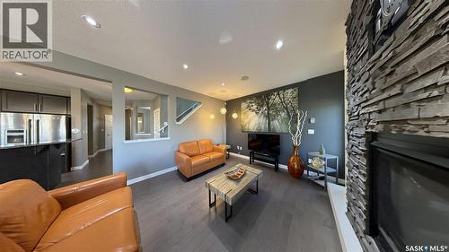 411 Flynn Lane, Saskatoon, SK - Indoor Photo Showing Other Room With Fireplace