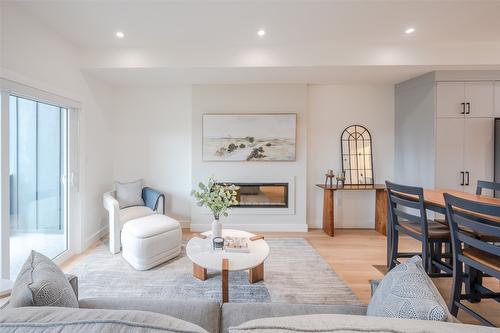 106-770 Argyle Street, Penticton, BC - Indoor Photo Showing Living Room With Fireplace