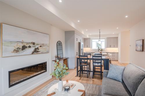106-770 Argyle Street, Penticton, BC - Indoor Photo Showing Living Room With Fireplace