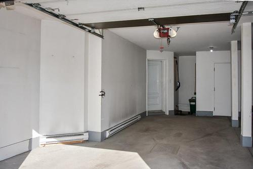 Garage - 2-65 Rue Du Sanctuaire, Sainte-Julie, QC - Indoor Photo Showing Garage