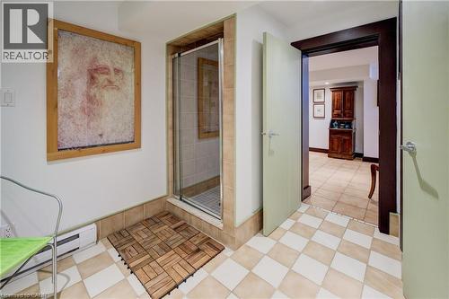 Hallway with baseboard heating and light tile patterned floors - 85 Union Boulevard, Kitchener, ON - Indoor