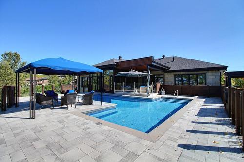 Back facade - 101 Rue Des Cormorans, Val-D'Or, QC - Outdoor With In Ground Pool With Deck Patio Veranda