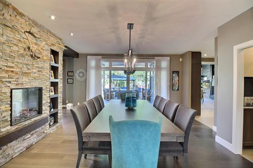 Dining room - 101 Rue Des Cormorans, Val-D'Or, QC - Indoor Photo Showing Dining Room With Fireplace
